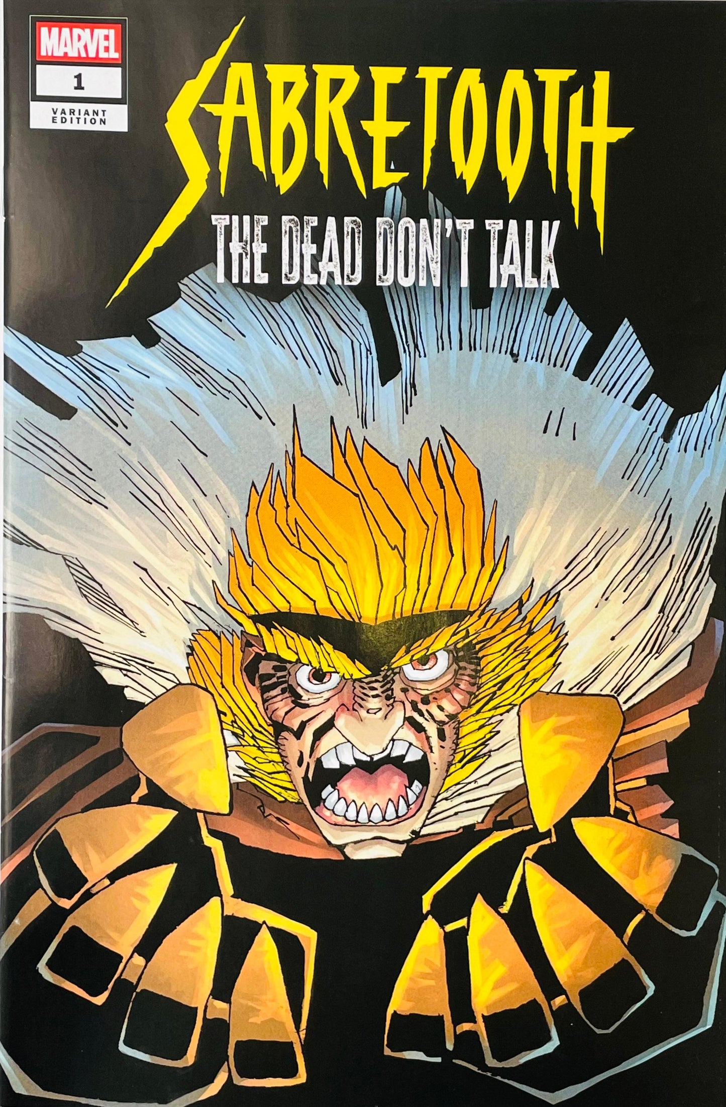 Marvel's Sabretooth comic book cover, issue 1, featuring a close-up illustration of the character Sabretooth with sharp yellow hair, an open snarling mouth, and metallic gold and black armor against a dark background with white radiating lines.