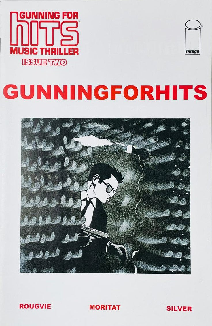 Gunning for Hits issue 2 comic book published by Image Comics featuring Moritat cover art of Martin Mills holding a silenced pistol in a recording studio setting.