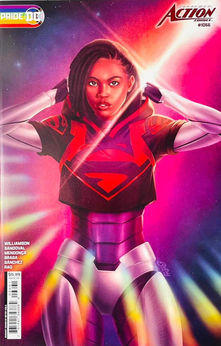 Natasha Irons as Steel in high-tech armor with a black and red hooded Superman shirt on the DC Pride variant cover of Action Comics 1066 by Betsy Cola for DC Comics.