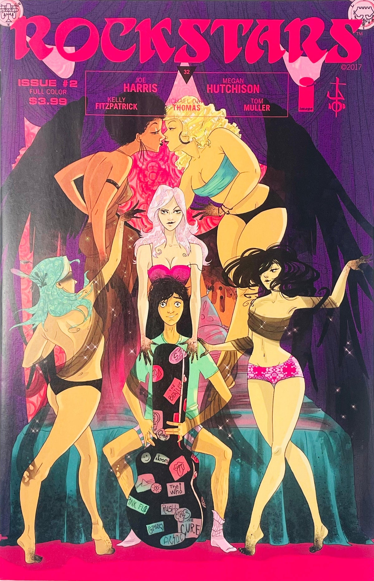 Jackie Mayer holding a sticker covered guitar case surrounded by winged groupies on the Megan Hutchison cover of Rockstars 2.