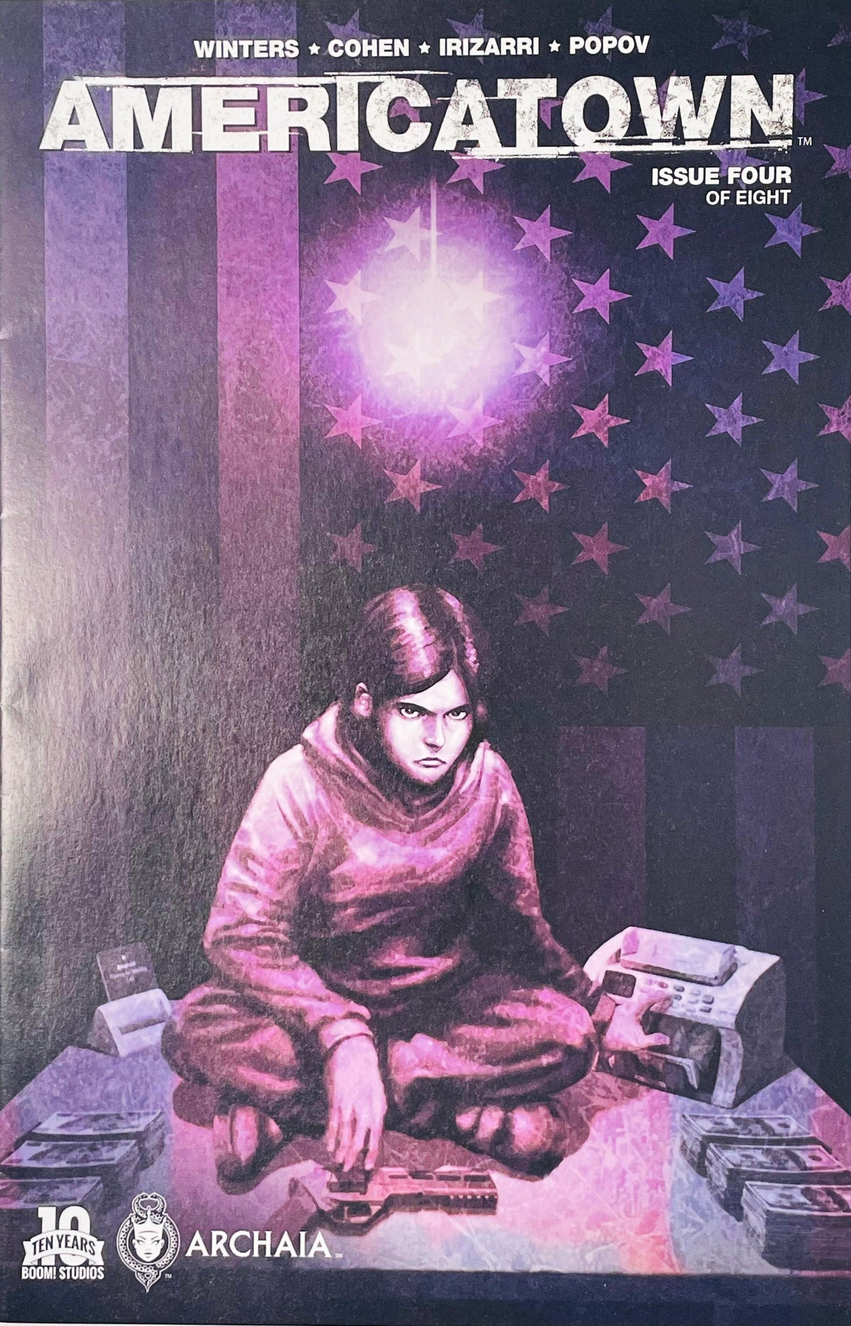 Young woman seated cross-legged by stacks of cash and a handgun under purple light on cover of Americatown issue 4.