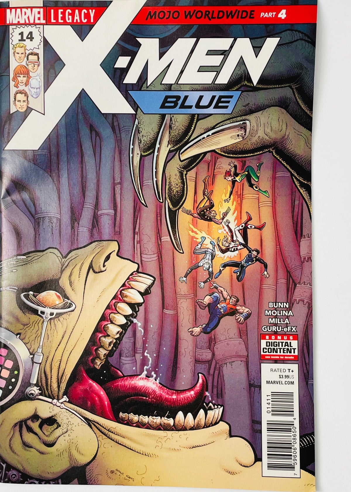 X-Men Blue #14 Arthur Adams comic book cover featuring the giant grotesque Mojo looming over tiny X-Men characters, with his enormous clawed hand and open mouth with a long red tongue dominating the scene, surrounded by surreal purple and pink Mojoverse structures beneath the large X-Men Blue logo.
