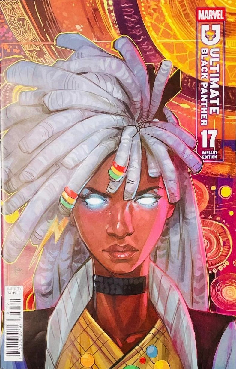 Ultimate Black Panther #17 Yasmine Putri 1:25 incentive variant comic book cover featuring a dark-skinned woman with glowing white eyes and long white dreadlocks decorated with colorful beads, wearing a dark choker and gold-patterned clothing against a vivid mystical background of orange, red, purple and gold geometric patterns.