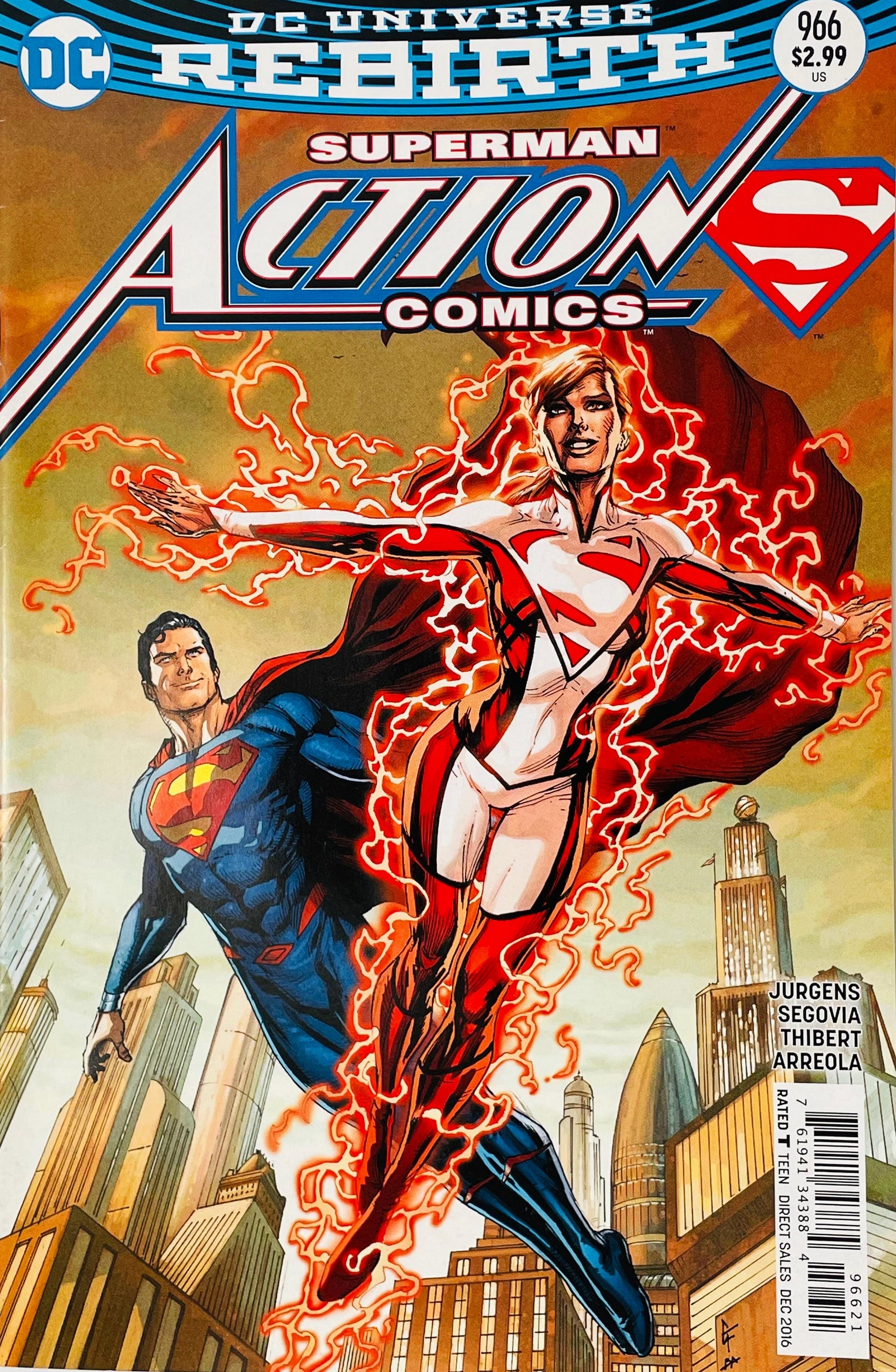 Action Comics #966 Clay Mann comic book cover featuring Superwoman in a white and red Superman-inspired costume flying in the foreground surrounded by crackling red energy, with Superman in his blue and red suit flying behind her above a futuristic city skyline, beneath the large Action Comics and Superman logos and DC Universe Rebirth branding.