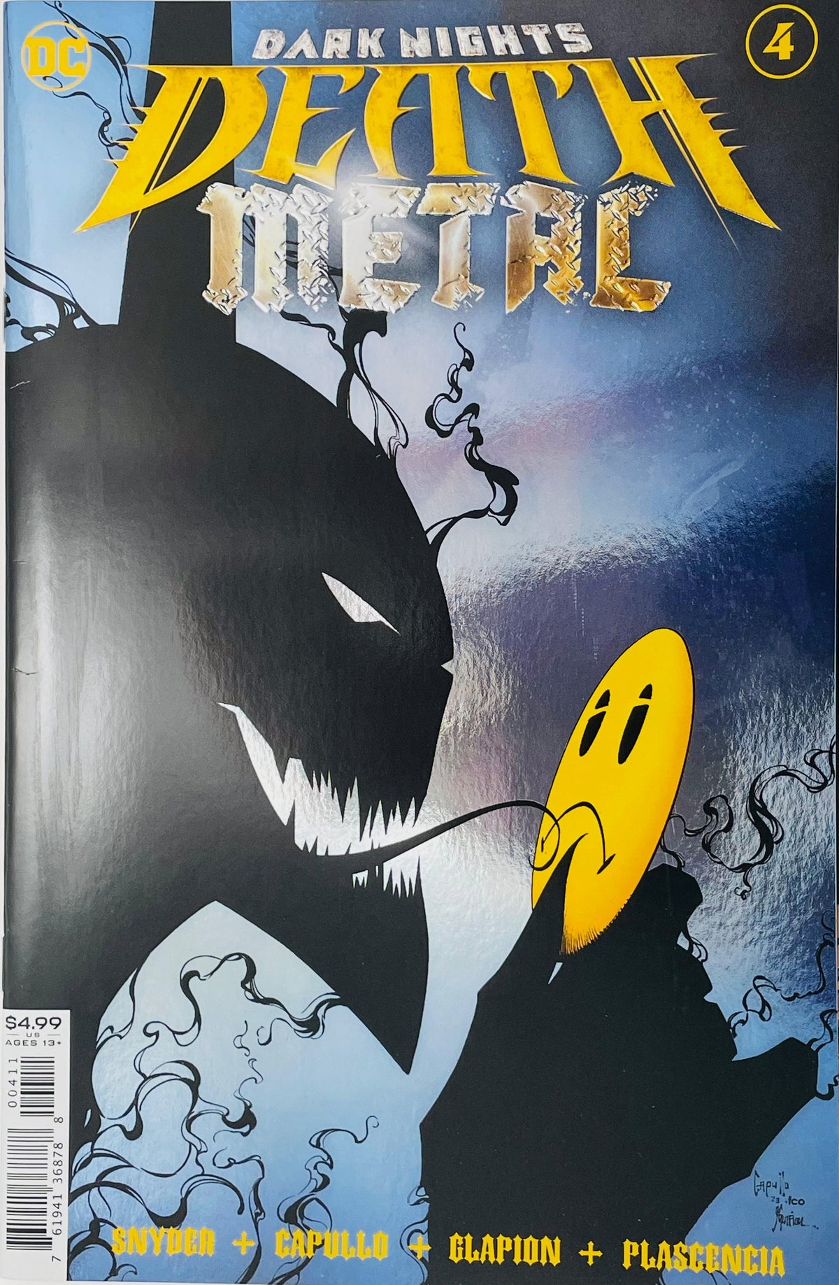 Dark Nights Death Metal issue 4 cover by Greg Capullo featuring a shadowy silhouette of the Darkest Knight holding a yellow smiley face mask over a sharp jagged grin.