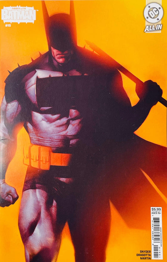 Batman comic book cover featuring Batman in a dark cape and cowl against a bright orange-yellow background, with DC and Batman logos visible.