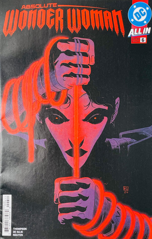 Absolute Wonder Woman issue 6 cover displaying a minimalist graphic face in purple and black holding a glowing red lasso wrapped around her wrists.