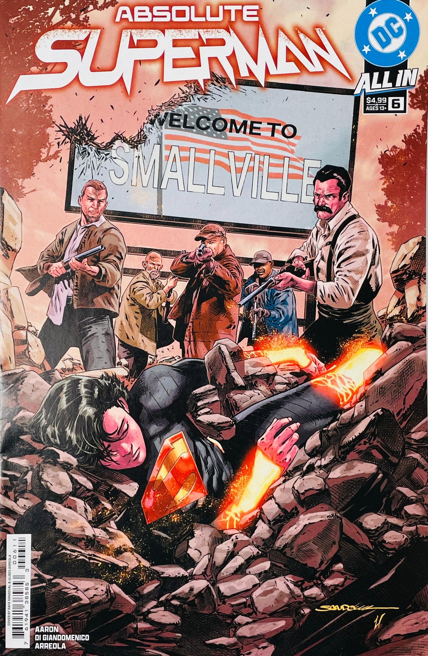 Absolute Superman issue 6 cover featuring a fallen, dark-suited Superman in stone rubble surrounded by armed townspeople under a Welcome to Smallville sign.