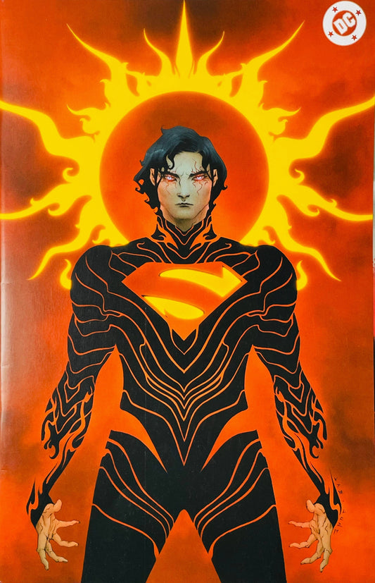 Action Comics issue 1070 virgin variant cover by Sana Takeda featuring Jon Kent with glowing red eyes and a dark patterned suit in front of a flaming sun halo.