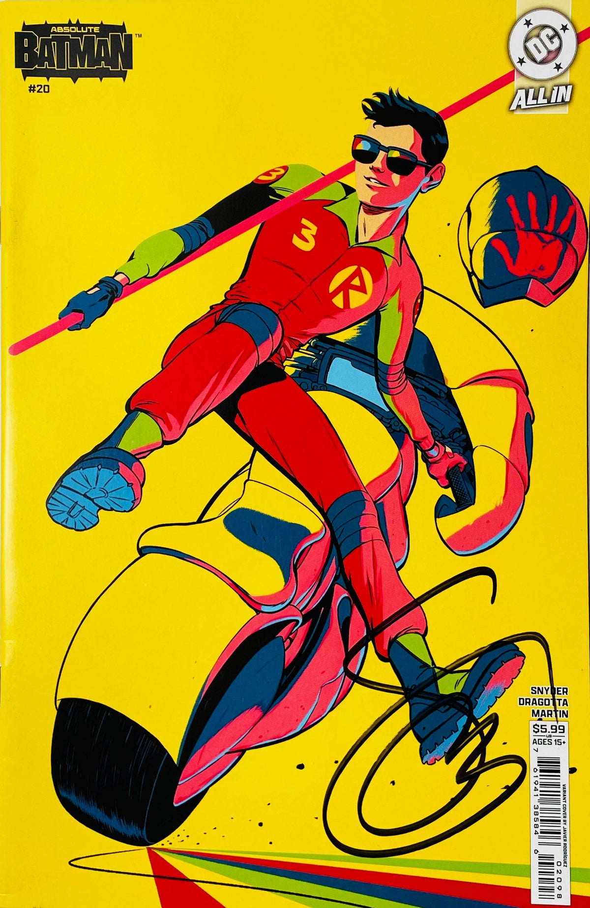 Signed Absolute Batman issue 20 variant cover by Javier Rodríguez showing Absolute Robin riding a futuristic yellow motorcycle with a black signature.