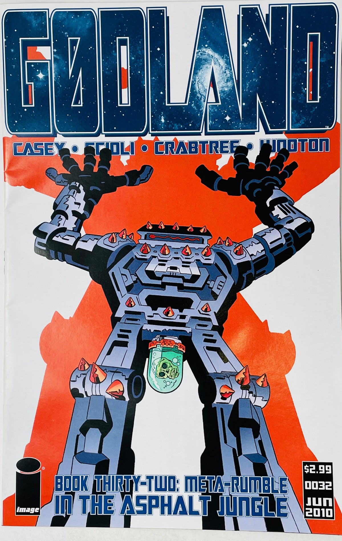 Godland issue 32 cover by Tom Scioli featuring a retro Jack Kirby-style giant blue mechanical robot raising its arms against a red background.