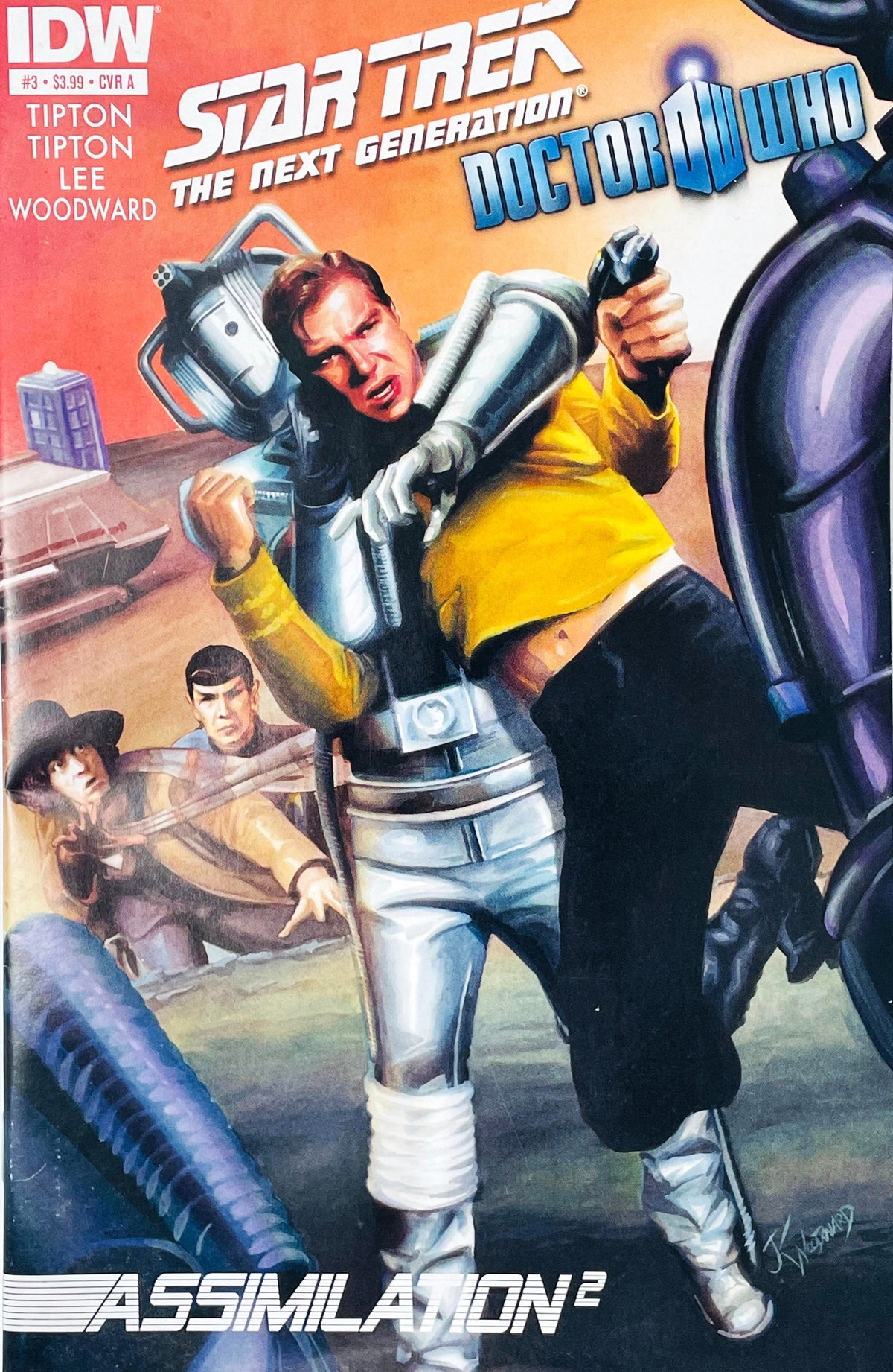Star Trek The Next Generation Doctor Who Assimilation2 issue 3 comic book featuring J.K. Woodward Cover A painted art of Kirk fighting a Cyberman with Fourth Doctor and Spock.