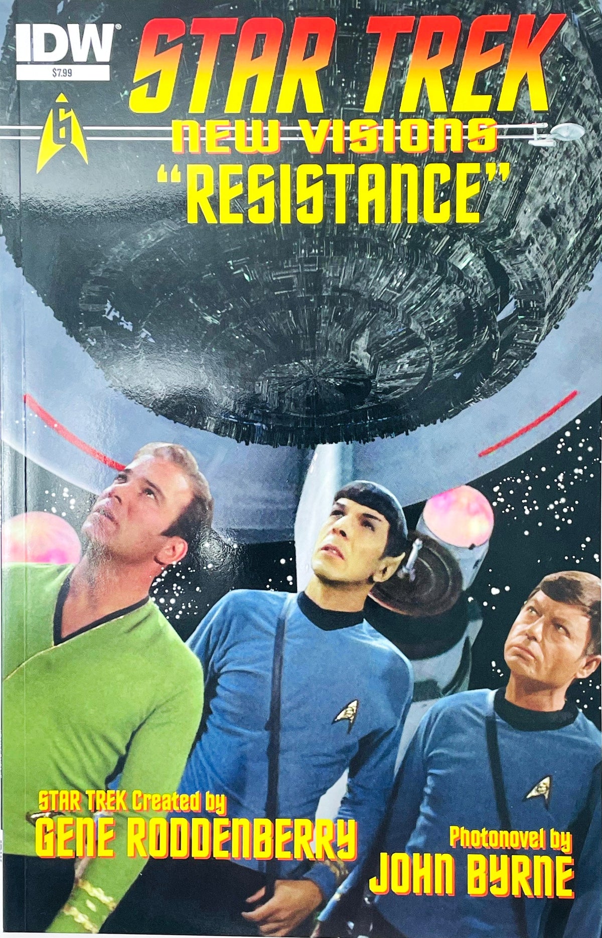 Star Trek New Visions Resistance photonovel published by IDW Publishing featuring John Byrne cover art of Kirk, Spock, and McCoy looking up at a giant Borg Cube.
