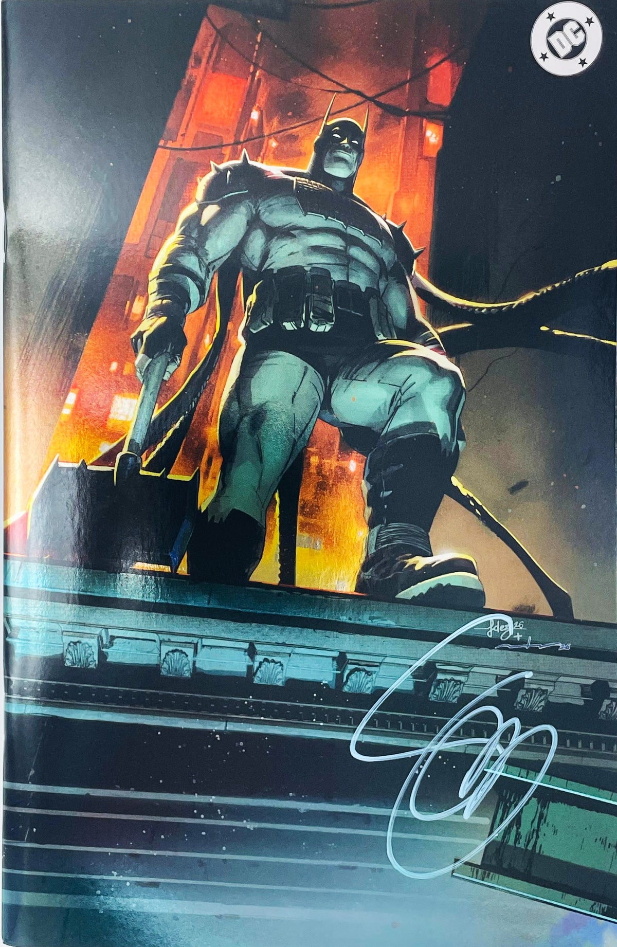 Absolute Batman issue 1 comic book signed by cover artist Jae Lee featuring virgin variant cover art of Absolute Batman standing on a rooftop holding a battle axe.