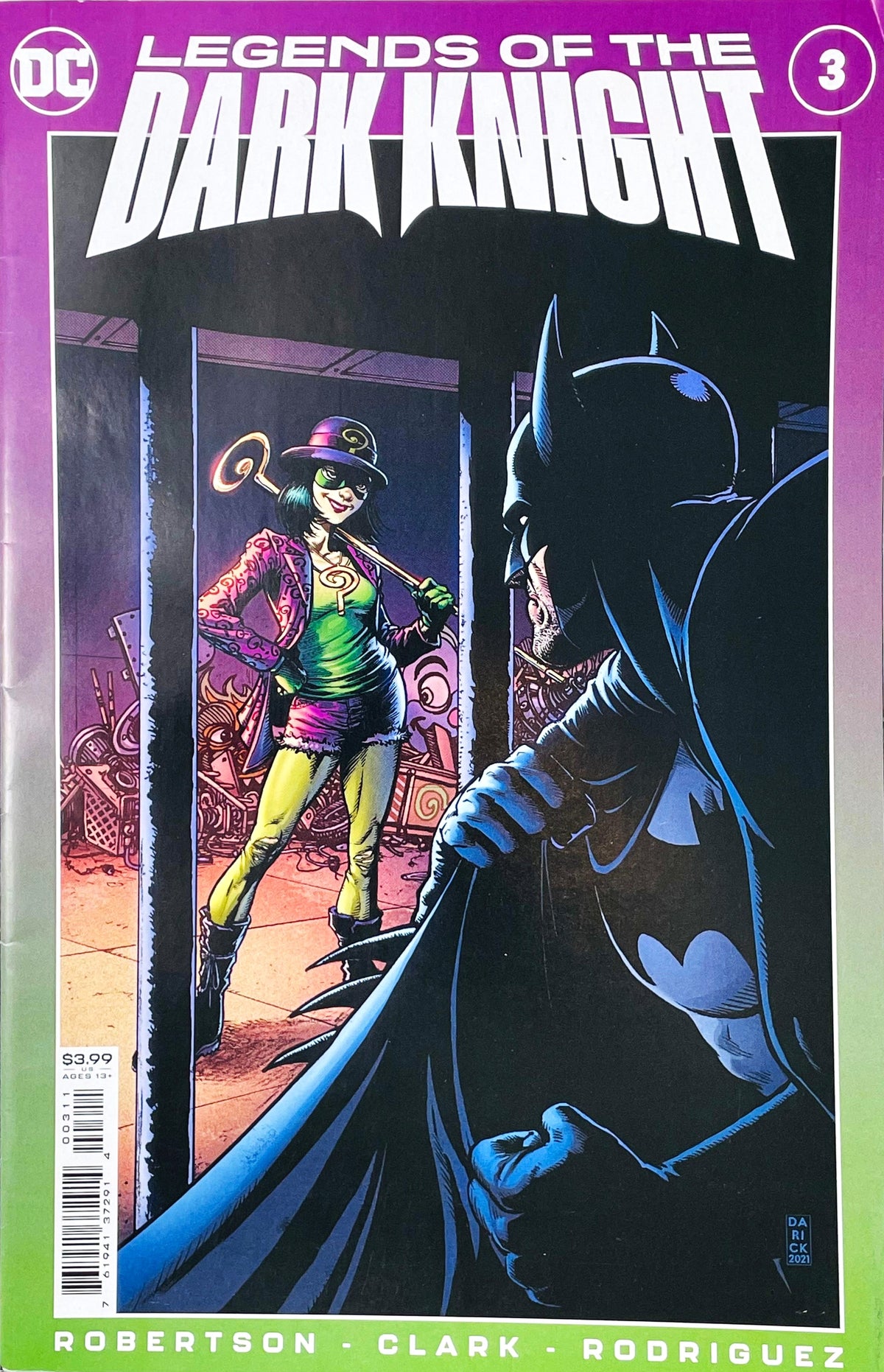 Legends of the Dark Knight issue 3 comic book published by DC Comics featuring Darick Robertson cover art of Batman watching Quizmaster through doorway bars.