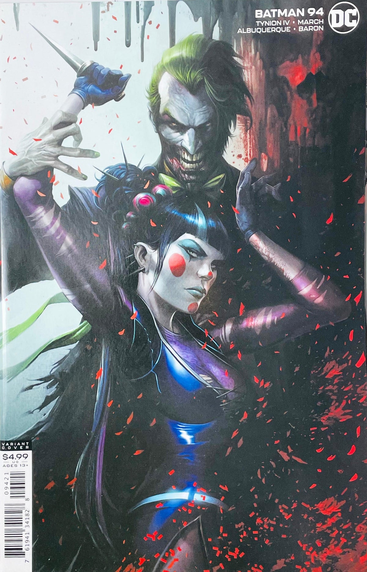 Batman issue 94 comic book published by DC Comics featuring Francesco Mattina card stock variant cover art of The Joker standing behind Punchline holding a knife amidst red confetti.