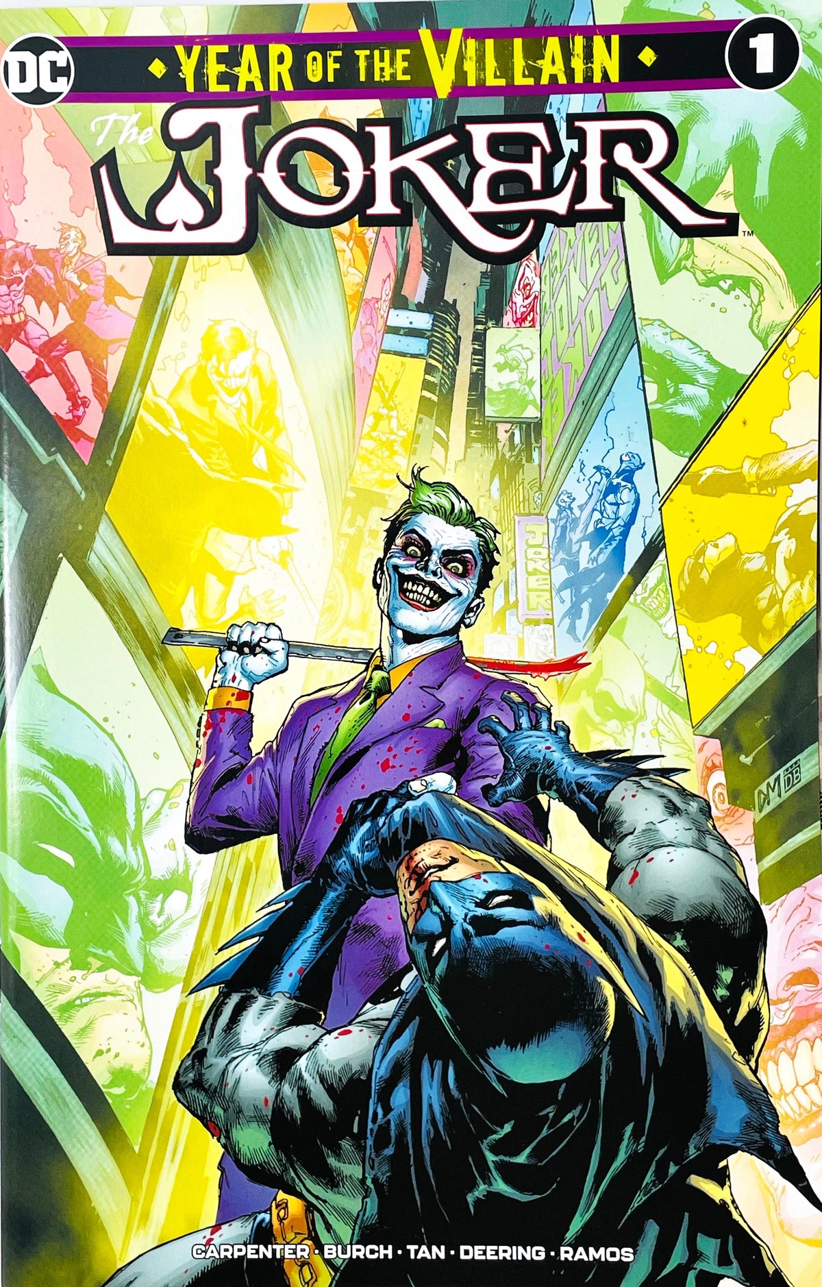 The Joker Year of the Villain issue 1 comic book published by DC Comics featuring Philip Tan cover art of The Joker with a bloody crowbar standing over a defeated Batman.