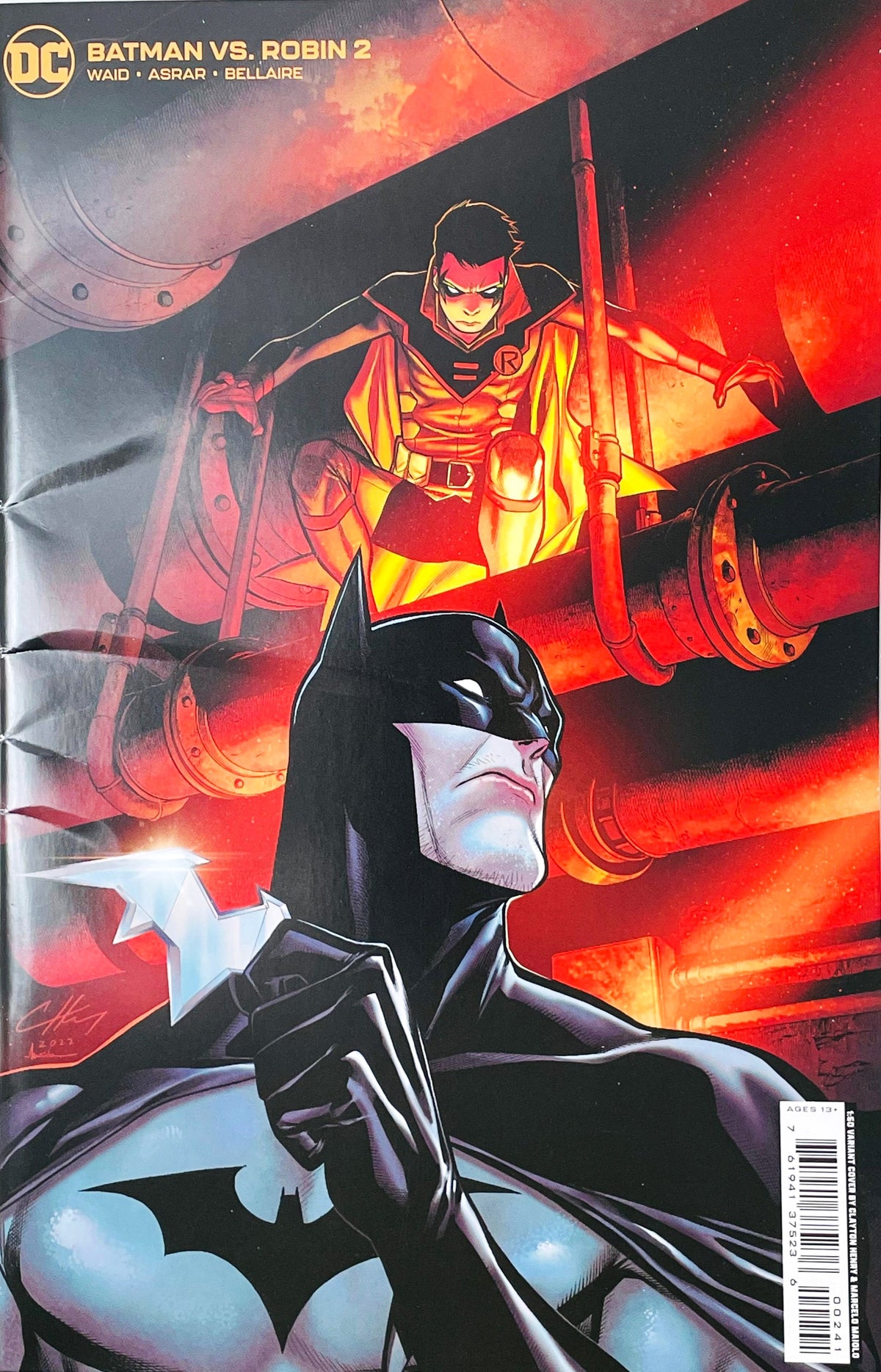 Batman vs Robin issue 2 comic book published by DC Comics featuring Clayton Henry 1:25 variant cover art of Batman holding a batarang under Damian Wayne crouching on pipes.