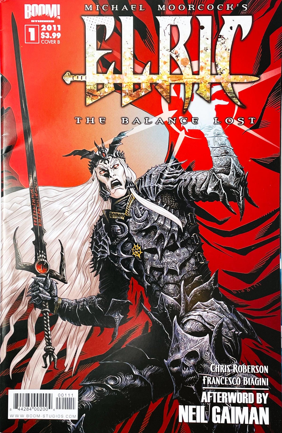 Michael Moorcock's Elric The Balance Lost #1 2011 BOOM Studios Cover B featuring Elric in ornate black armor wielding his sword against a red and black background, with Francesco Biagini cover artwork