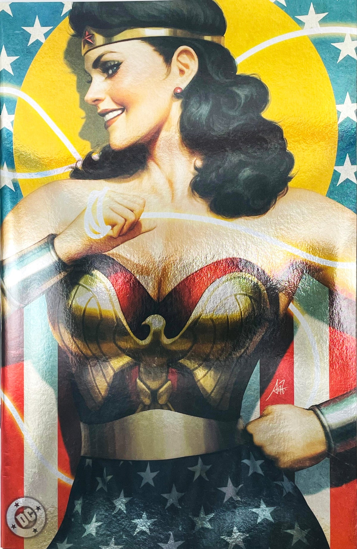 Wonder Woman issue 750 comic book published by DC Comics featuring Stanley Artgerm Lau virgin foil variant cover art of Wonder Woman with her Lasso of Truth.