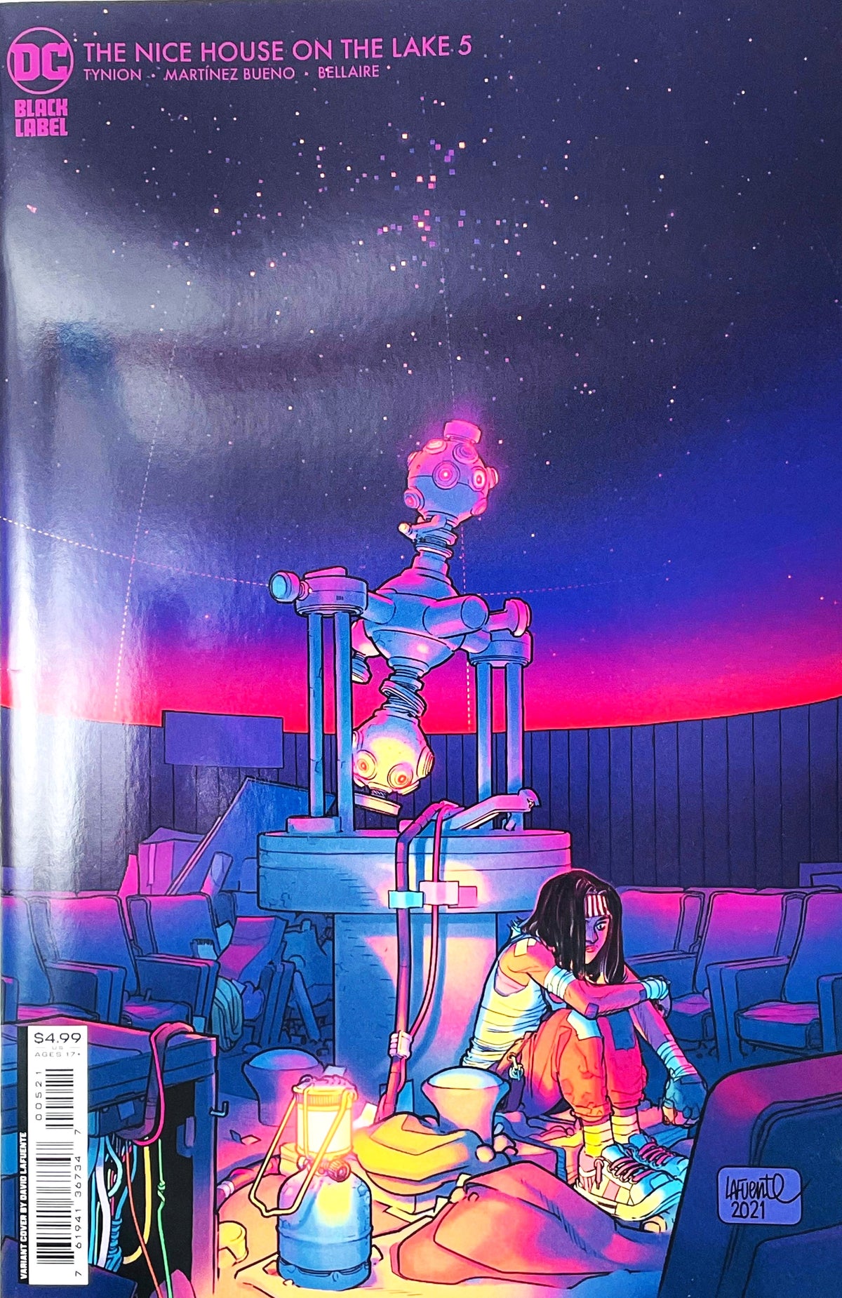 The Nice House on the Lake issue 5 comic book published by DC Black Label featuring David Lafuente variant cover art of Veronica sitting in a glowing neon planetarium beneath a star projector.
