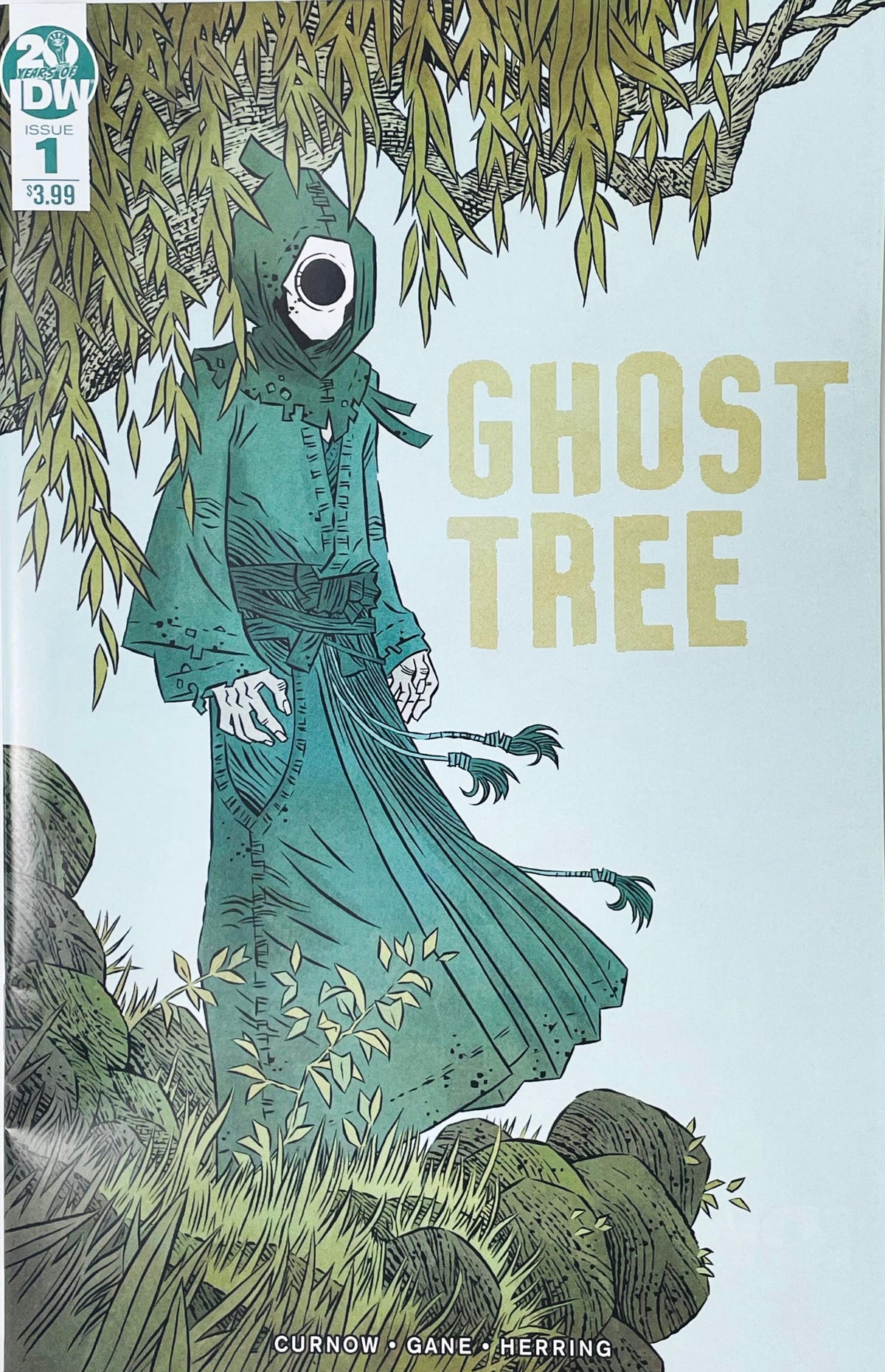 Ghost Tree issue 1 comic book published by IDW Publishing featuring Simon Gane cover art of a masked ghost figure in green robes under a willow tree.