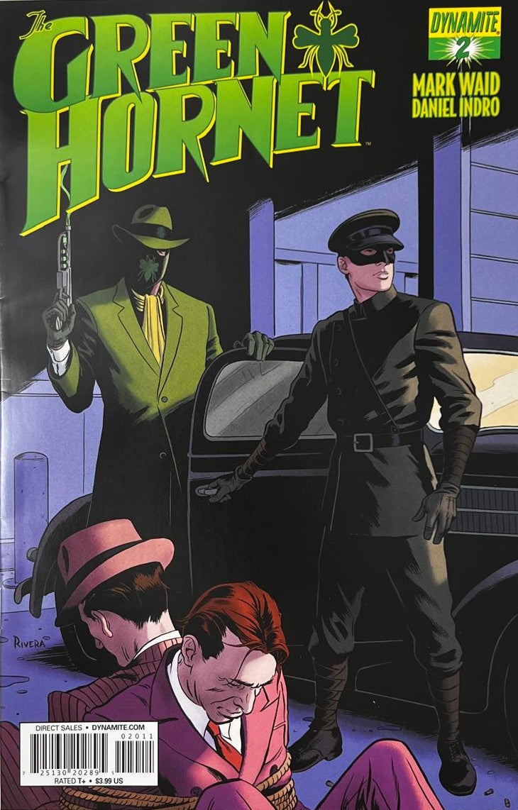 The Green Hornet issue 2 comic book published by Dynamite Entertainment featuring Paolo Rivera cover art of Green Hornet holding a gas gun beside Kato and the Black Beauty car with bound mobsters in the foreground.