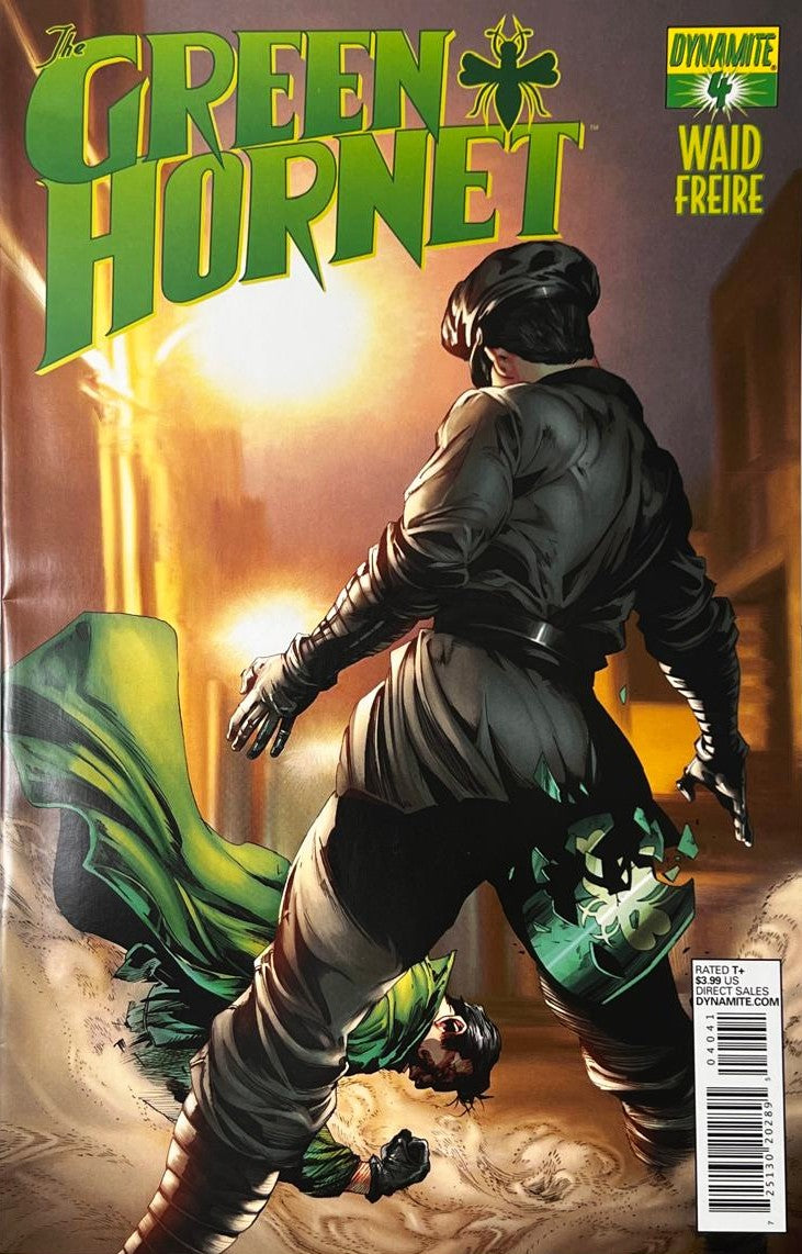 The Green Hornet issue 4 comic book published by Dynamite Entertainment featuring Ronilson Freire cover art of Kato standing victorious over a defeated Green Hornet in a alleyway under a streetlight.