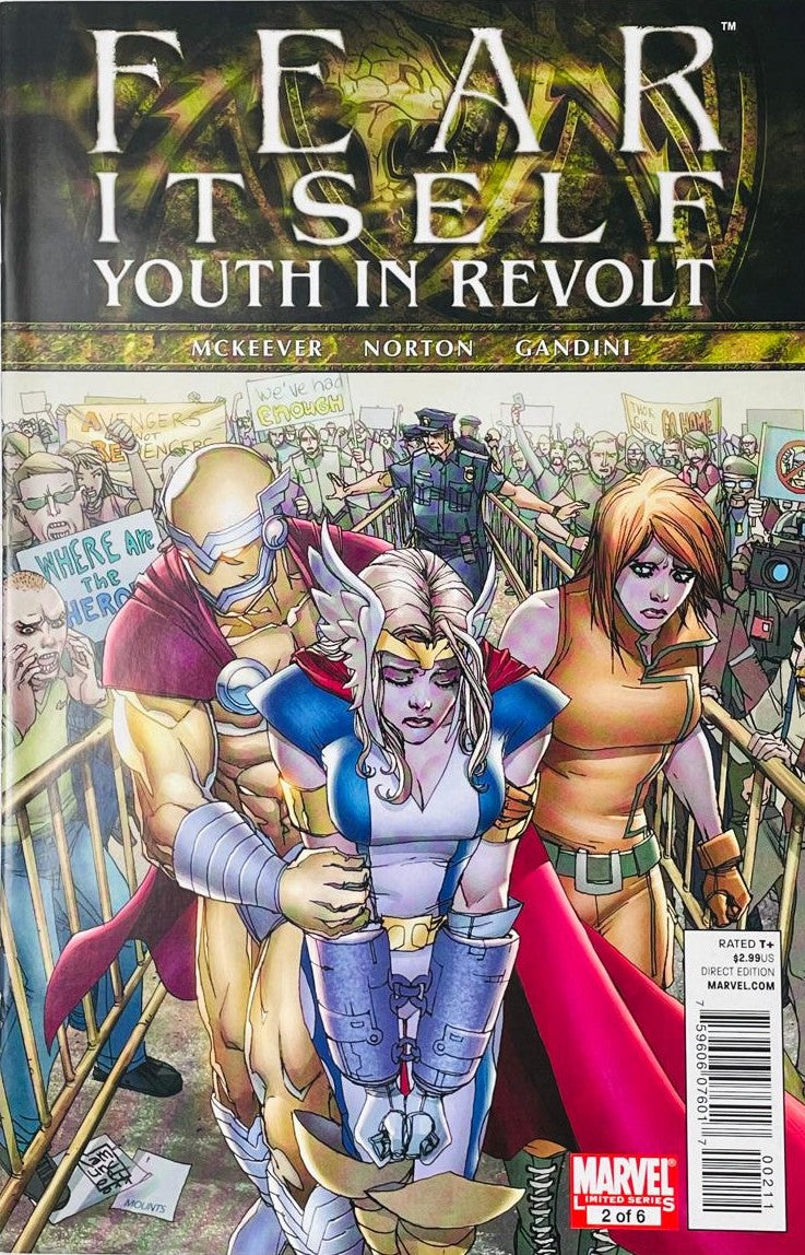 Fear Itself Youth In Revolt issue 2 comic book published by Marvel Comics featuring Kalman Andrasofszky cover art of Thor Girl, Justice, and Firestar in handcuffs.