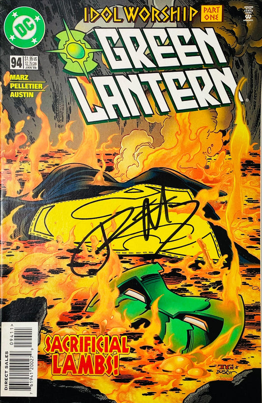 Green Lantern issue 94 signed comic book published by DC Comics featuring cover art of Kyle Rayner mask in flames and black signature across cover.