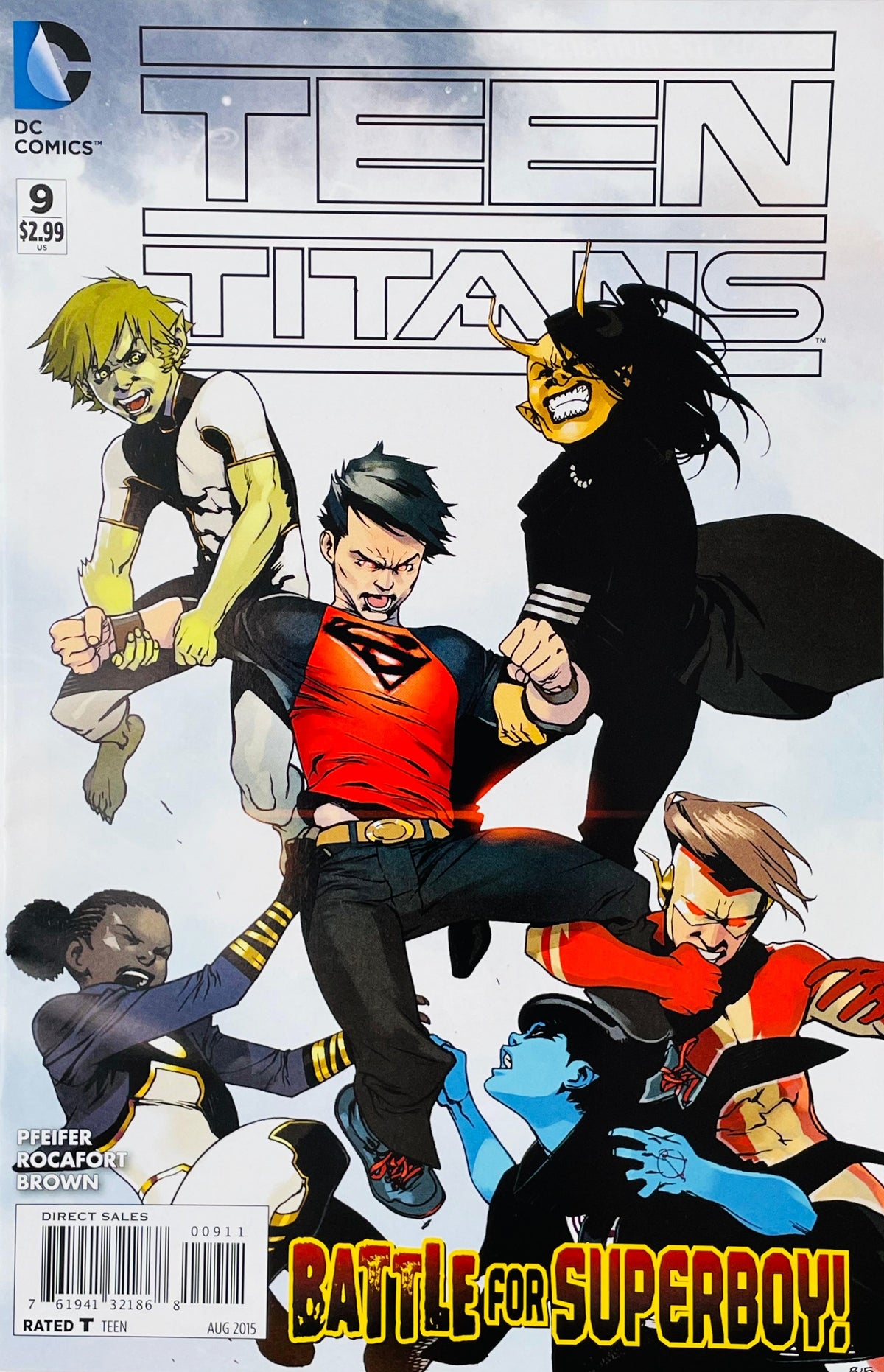Teen Titans issue 9 comic book published by DC Comics featuring Superboy being pulled by Beast Boy and Raven cover art by Kenneth Rocafort.