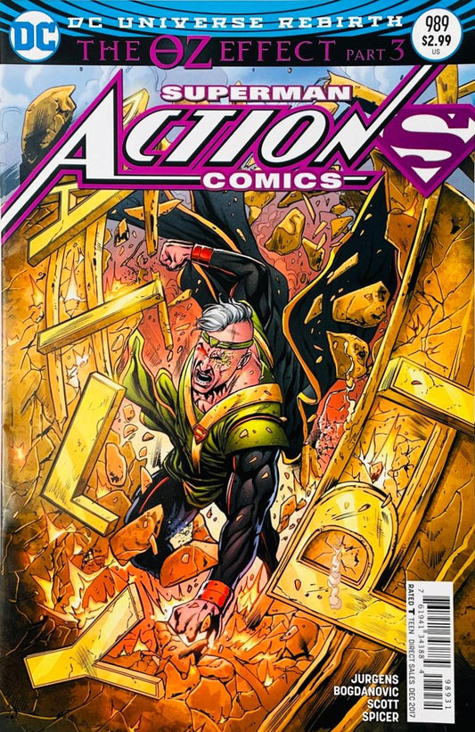 Mr. Oz smashing through collapsing golden debris with Superman pursuing him on the cover of Action Comics 989 by Nick Bradshaw for DC Comics.
