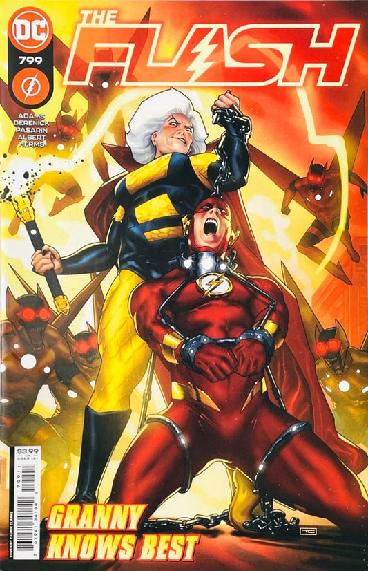 Granny Goodness holding a chained and shackled Flash Wally West on his knees with Parademons in the background on the cover of The Flash 799 by Taurin Clarke for DC Comics.
