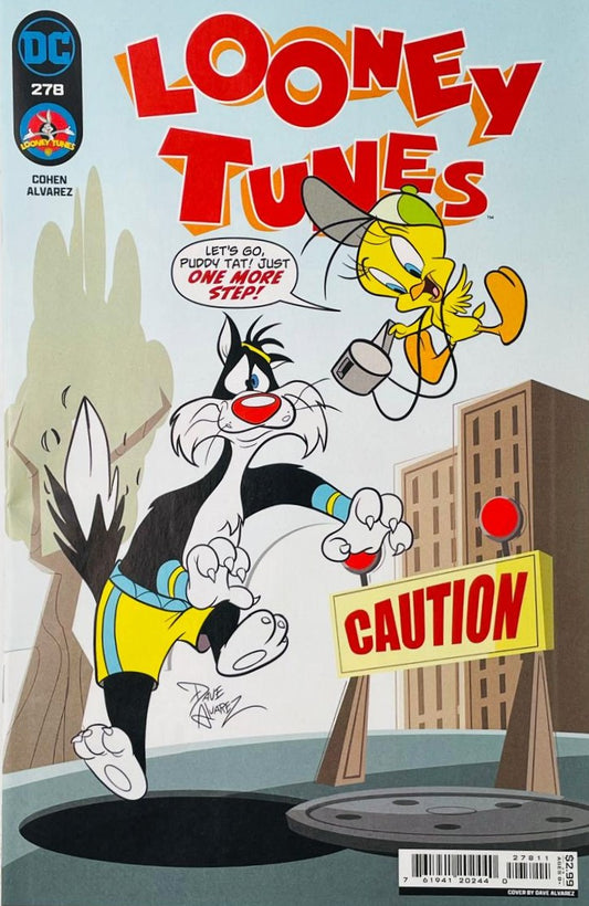 Tweety Bird in a sun hat leading Sylvester the Cat toward an open manhole next to a Caution sign on the cover of Looney Tunes 278 by Dave Alvarez for DC Comics.