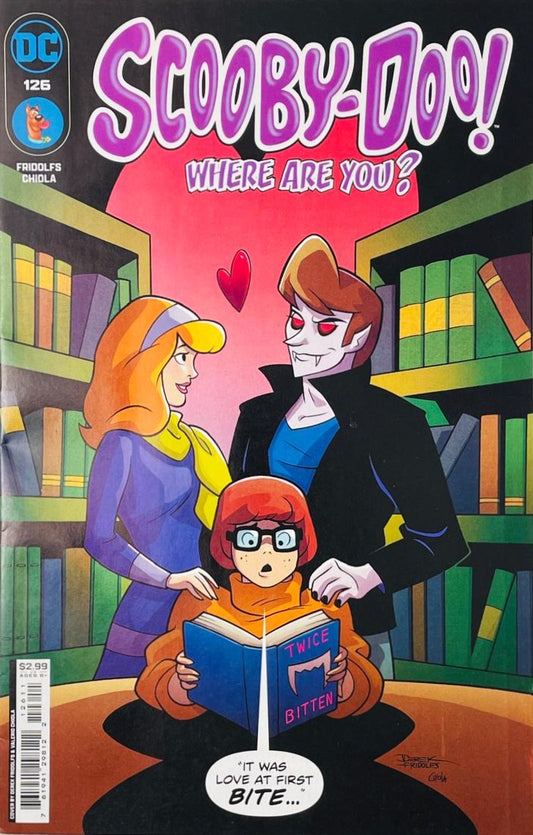 Daphne Blake looking enamored with a vampire while Velma reads a book titled Twice Bitten on the cover of Scooby-Doo Where Are You 126 for DC Comics.