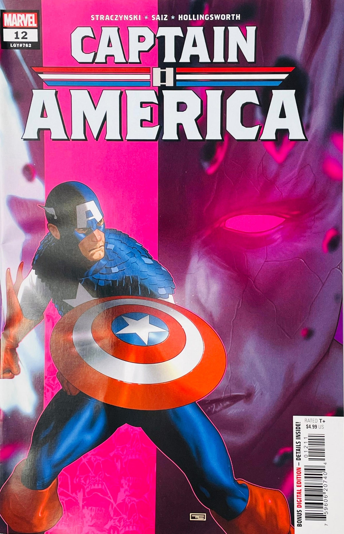 Captain America holding shield in front of a giant glowing pink shadowy face on the cover of Captain America 12.