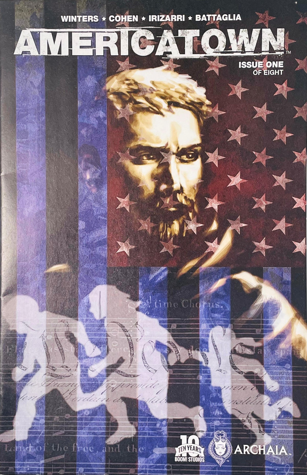 Bearded man portrait overlaid with American flag stars and silhouette runners on cover of Americatown issue 1.