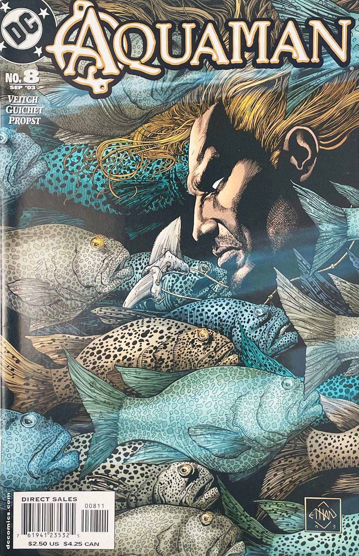 Close-up profile of long-haired Aquaman swimming inside a dense school of fish on Ethan Van Sciver cover of Aquaman issue 8.