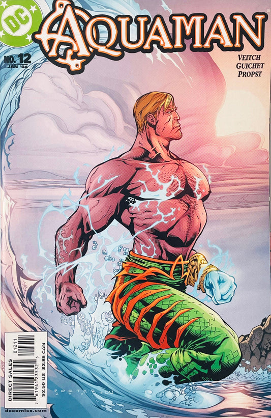Shirtless Aquaman with glowing elemental water power rising from ocean surf on Howard Porter cover of Aquaman issue 12.
